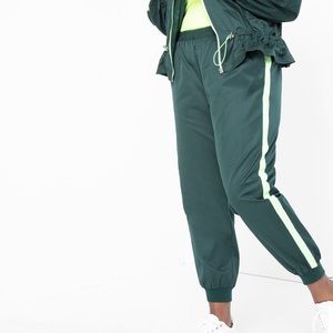 Green sweat pants with a lime stipe down side